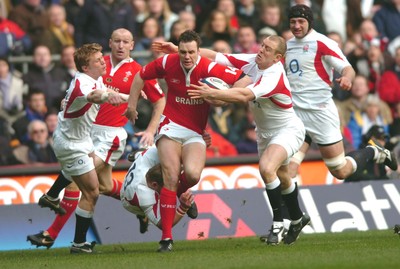 04.02.06  England  v Wales  Mark Jones tried to run through Mike Tindall, Josh Lewsey and Jamie Noon.  