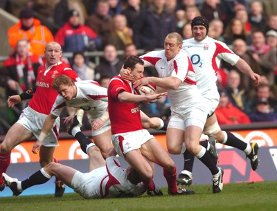 04.02.06  England  v Wales  Mark Jones is tackled by Mike Tindall and Mark Cueto.  