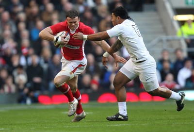 250212 - England v Wales, RBS 6 Nations - Wales' Jamie Roberts holds off England's Manusamoa Tuilagi 