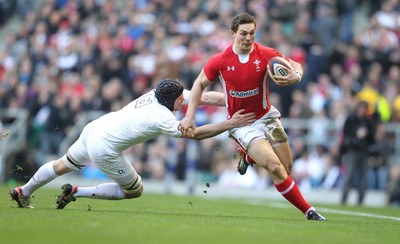 250212 England v WalesWales' George North runs is tackled by England's Ben Morgan