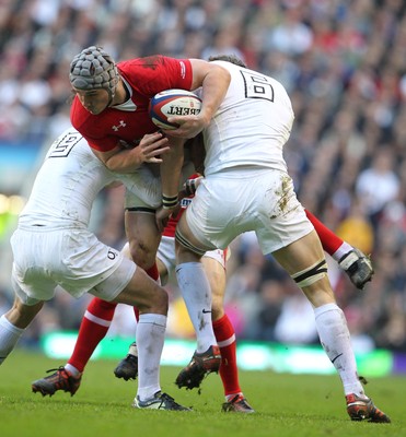 250212 England v WalesWales' Jonathan Davies is tackled by England's Tom Croft and England's Lee Dickson