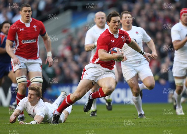 250212 - England v Wales, RBS 6 Nations - Wales' George North is tackled by England's David Strettle 