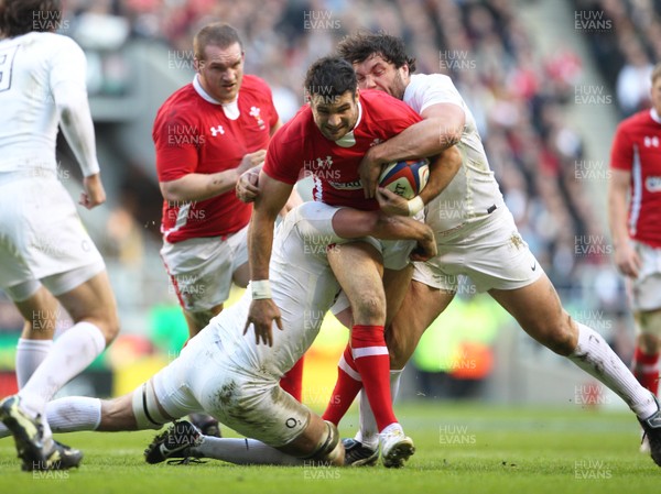 250212 England v WalesWales' Mike Phillips is tackled by England's Alex Corbisiero and England's Tom Croft