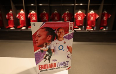 250426 - England v Wales, 2026 Guinness Women’s 6 Nations - A match programme with Wales match jerseys hanging in the changing room ahead of the match