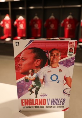 250426 - England v Wales, 2026 Guinness Women’s 6 Nations - A match programme with Wales match jerseys hanging in the changing room ahead of the match