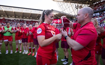 250426 - England v Wales, 2026 Guinness Women’s 6 Nations - Freya Bell of Wales receives her first cap from Sean Lynn, Wales Women head coach