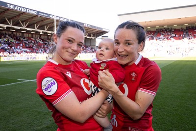 250426 - England v Wales, 2026 Guinness Women’s 6 Nations - Alisha Joyce of Wales and Jasmine Joyce of Wales with Ralphie at the end of the match