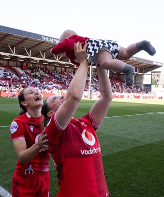 250426 - England v Wales, 2026 Guinness Women’s 6 Nations - Alisha Joyce of Wales and Jasmine Joyce of Wales with Ralphie at the end of the match