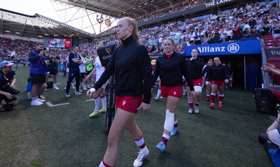 250426 - England v Wales, 2026 Guinness Women’s 6 Nations - Catherine Richards of Wales and Freya Bell of Wales walks out at the start of the match