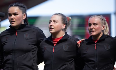 250426 - England v Wales, 2026 Guinness Women’s 6 Nations - Jorja Aiono of Wales, Molly Reardon of Wales and Seren Singleton of Wales line up for the anthems ahead of the match