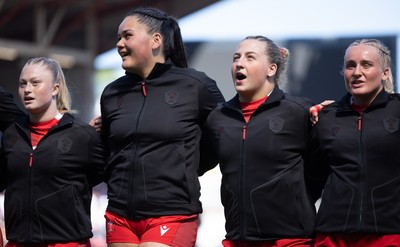 250426 - England v Wales, 2026 Guinness Women’s 6 Nations - Seren Lockwood of Wales, Jorja Aiono of Wales, Molly Reardon of Wales and Seren Singleton of Wales line up for the anthems ahead of the match