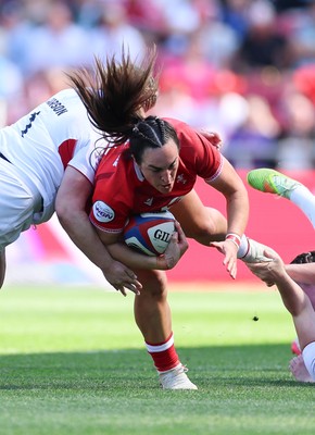 250426 - England v Wales, 2026 Guinness Women’s 6 Nations - Courtney Keight of Wales is tackled by Mackenzie Carson of England 