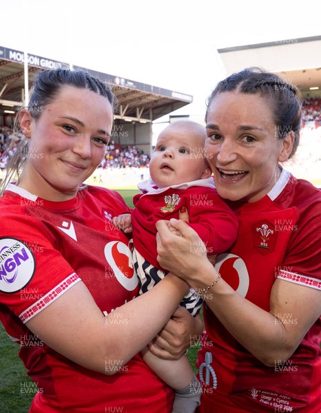 250426 - England v Wales, 2026 Guinness Women’s 6 Nations - Alisha Joyce of Wales and Jasmine Joyce of Wales with Ralphie at the end of the match