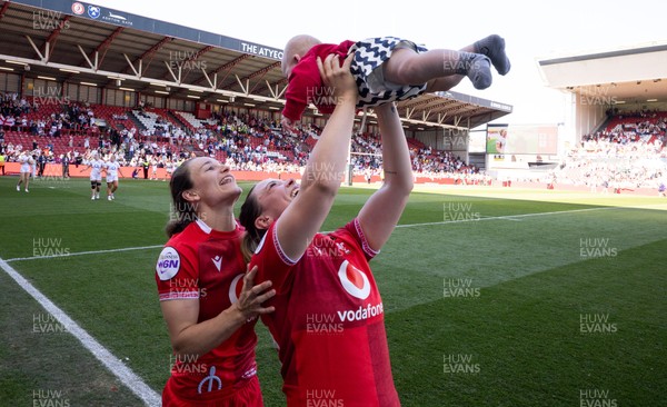 250426 - England v Wales, 2026 Guinness Women’s 6 Nations - Alisha Joyce of Wales and Jasmine Joyce of Wales with Ralphie at the end of the match