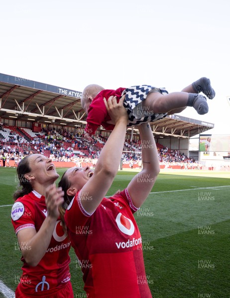 250426 - England v Wales, 2026 Guinness Women’s 6 Nations - Alisha Joyce of Wales and Jasmine Joyce of Wales with Ralphie at the end of the match