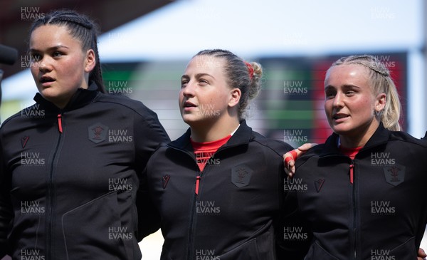250426 - England v Wales, 2026 Guinness Women’s 6 Nations - Jorja Aiono of Wales, Molly Reardon of Wales and Seren Singleton of Wales line up for the anthems ahead of the match
