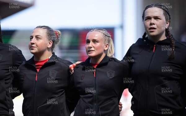250426 - England v Wales, 2026 Guinness Women’s 6 Nations - Molly Reardon of Wales, Seren Singleton of Wales and Maisie Davies of Wales line up for the anthems ahead of the match