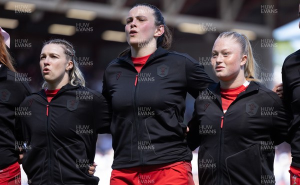 250426 - England v Wales, 2026 Guinness Women’s 6 Nations - Keira Bevan of Wales, Branwen Metcalfe of Wales and Seren Lockwood of Wales line up for the anthems ahead of the match