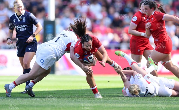 250426 - England v Wales, 2026 Guinness Women’s 6 Nations - Courtney Keight of Wales is tackled 
