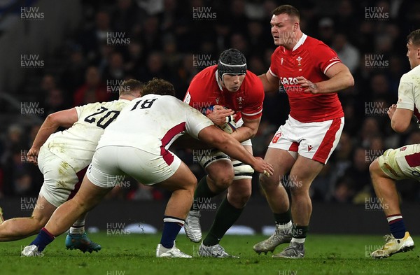 260222 - England v Wales - Guinness Six Nations 2022 - Seb Davies of Wales is tackled by Will Stuart of England