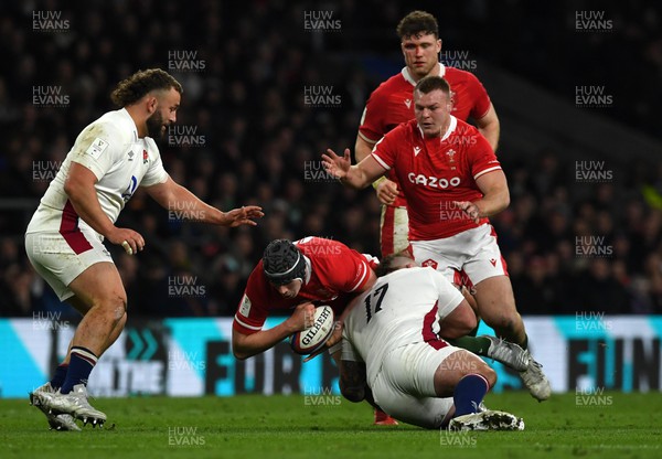 260222 - England v Wales - Guinness Six Nations 2022 - Seb Davies of Wales is tackled by Joe Marler of England