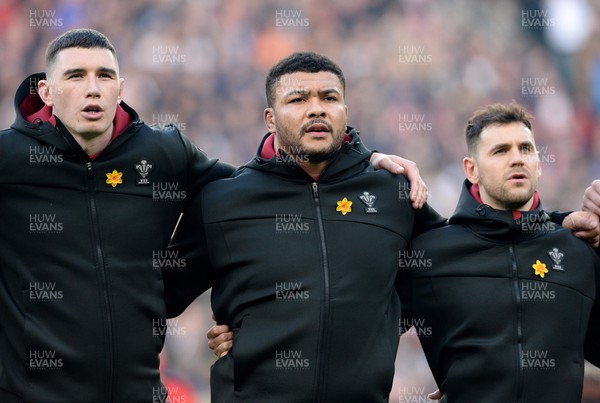 260222 - England v Wales - Guinness Six Nations 2022 - Seb Davies, Leon Brown and Tomos Williams of Wales during the anthems