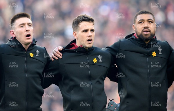 260222 - England v Wales - Guinness Six Nations 2022 - Josh Adams, Kieran Hardy and Taulupe Faletau of Wales during the anthems