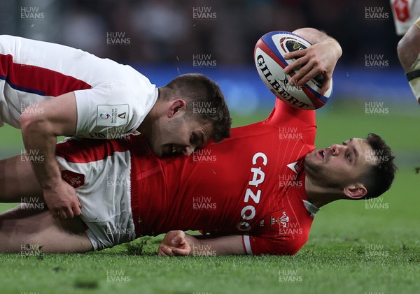 260222 - England v Wales - Guinness 6 Nations - Tomos Williams of Wales is tackled by Harry Randall of England