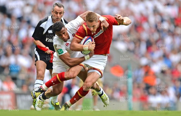 290516 - England v Wales - Old Mutual Wealth Cup -Liam Williams of Wales is tackled by Anthony Watson of England