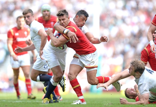 290516 - England v Wales - Old Mutual Wealth Cup -Rhys Webb of Wales is tackled by Luther Burrell of England