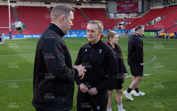 300324 - England v Wales, Guinness Women’s 6 Nations -  Ioan Cunningham, Wales Women head coach speaks to captain Hannah Jones of Wales ahead of the start of the match