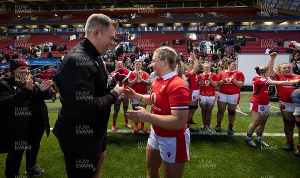 300324 - England v Wales, Guinness Women’s 6 Nations - Ioan Cunningham, Wales Women head coach presents her first cap to Molly Reardon at the end of the match