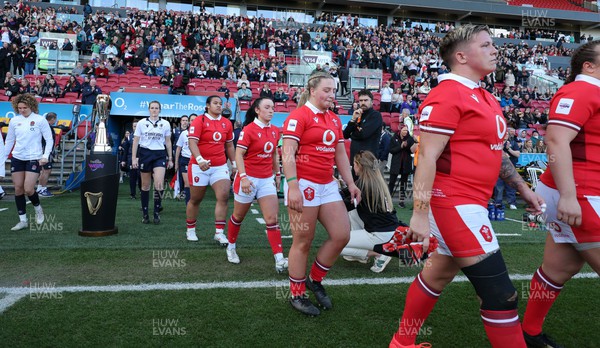 300324 - England v Wales, Guinness Women’s 6 Nations - Donna Rose of Wales, Molly Reardon of Wales and Sian Jones of Wales walk out at the start of the match