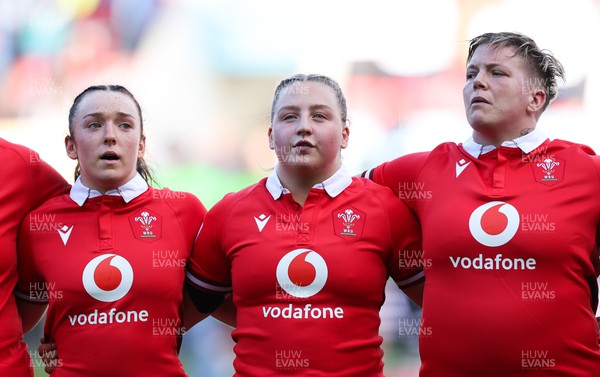 300324 - England v Wales, Guinness Women’s 6 Nations - Sian Jones of Wales, Molly Reardon of Wales and Donna Rose of Wales during the anthem