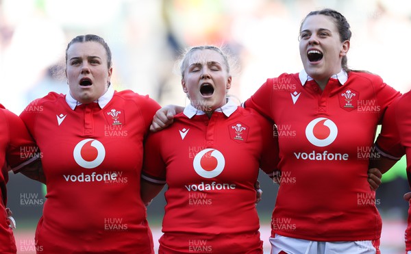 300324 - England v Wales, Guinness Women’s 6 Nations - Carys Phillips of Wales, Alex Callender of Wales and Natalia John of Wales during the anthem