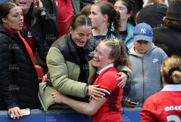 300324 - England v Wales, Guinness Women’s 6 Nations - Carys Cox of Wales with the injured Jasmine Joyce of Wales at the end of the match