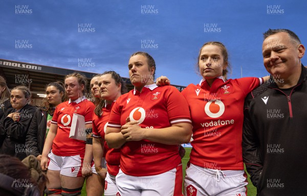 300324 - England v Wales, Guinness Women’s 6 Nations - Jenni Scoble, Gwennan Hopkins, Abbey Constable, Carys Cox, Abbie Fleming, Carys Phillips, Lisa Neumann and Shaun Connor, Wales Women attack coach listen to Ioan Cunningham, Wales Women head coach at the end of the match