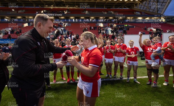 300324 - England v Wales, Guinness Women’s 6 Nations - Molly Reardon of Wales is presented with her first cap by Ioan Cunningham, Wales Women head coach at the end of the match