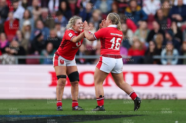 300324 - England v Wales, Guinness Women’s 6 Nations - Alex Callender of Wales congratulates Molly Reardon of Wales  as she runs on for her first cap