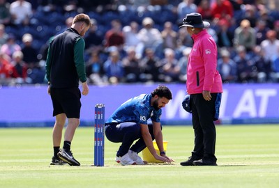 010625 - England v West Indies - 2nd ODI at Sophia Gardens - Saqib Mahmood of England puts sand down on the wicket