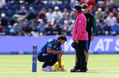 010625 - England v West Indies - 2nd ODI at Sophia Gardens - Saqib Mahmood of England puts sand down on the wicket