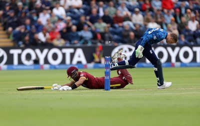 010625 - England v West Indies - 2nd ODI at Sophia Gardens - Jos Buttler of England attempts to run out Brandon King of West Indies