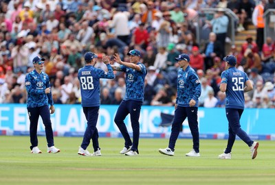 010625 - England v West Indies - 2nd ODI at Sophia Gardens - Brydon Carse of England celebrates with team mates after catching the ball to dismiss Brandon King