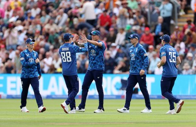 010625 - England v West Indies - 2nd ODI at Sophia Gardens - Brydon Carse of England celebrates with team mates after catching the ball to dismiss Brandon King