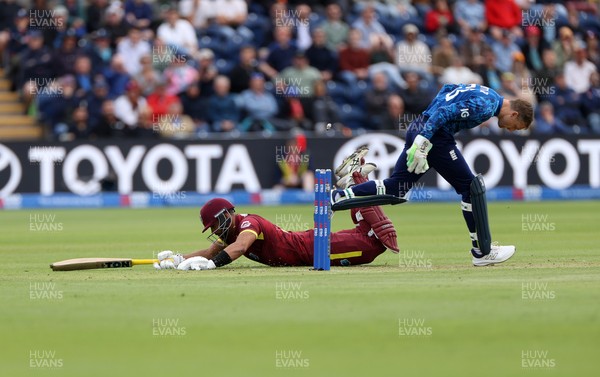 010625 - England v West Indies - 2nd ODI at Sophia Gardens - Jos Buttler of England attempts to run out Brandon King of West Indies