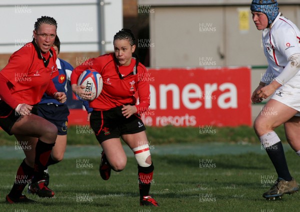 02.02.08 The Women's 6 Nations. England vs. Wales. London Irish Amateurs RFC. Sunbury, London. 
 
Amy Day makes a break inside England's Katy Storie. 
 
