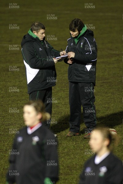 06.02.10 England v Wales - Women's - 6 Nations -  Wales coach Jason Lewis(L) discusses tactic with forwards coach Lisa Burgees. 