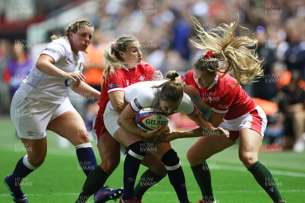 140922 - England Women v Wales Women, Women’s Rugby World Cup Warm-up Match - Hannah Jones of Wales and Lowri Norkett of Wales tackle Lydia Thompson of England