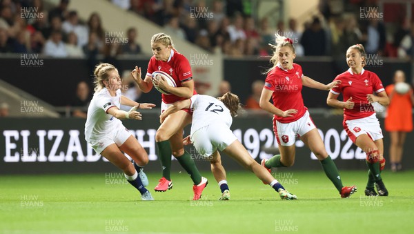 140922 - England Women v Wales Women, Women’s Rugby World Cup Warm-up Match - Carys Williams-Morris of Wales crashes into the English defence