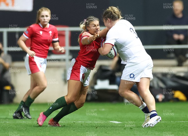 140922 - England Women v Wales Women, Women’s Rugby World Cup Warm-up Match - Lowri Norkett of Wales tackles Sarah Bern of England